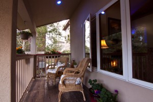 Enjoy the peaceful surroundings of the sitting area on the front porch